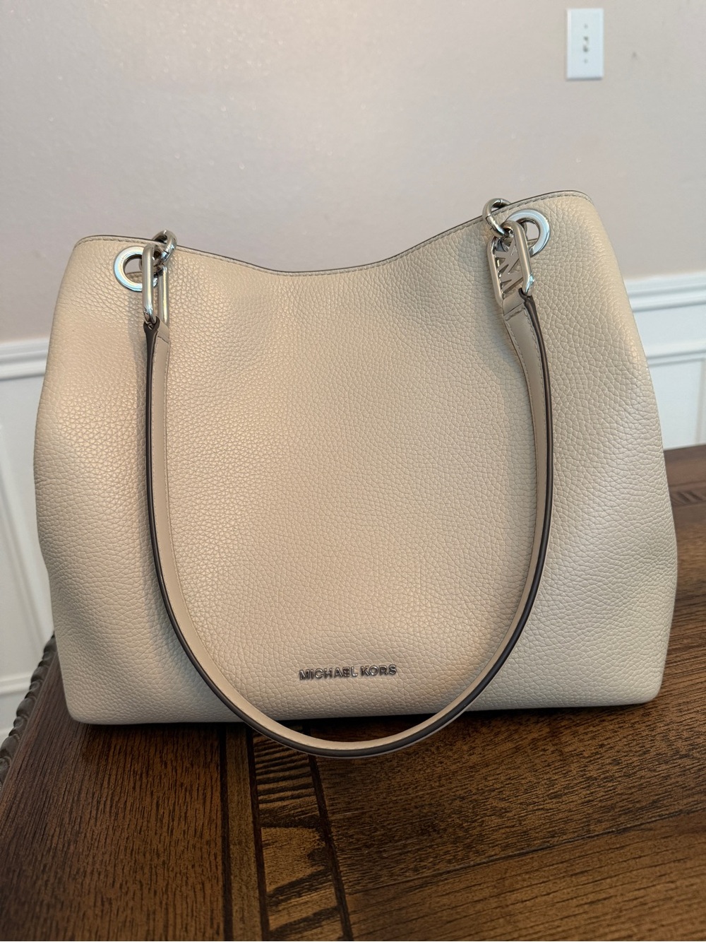 Michael Kors Raven pebbled leather shoulder bag featuring silver-tone hardware